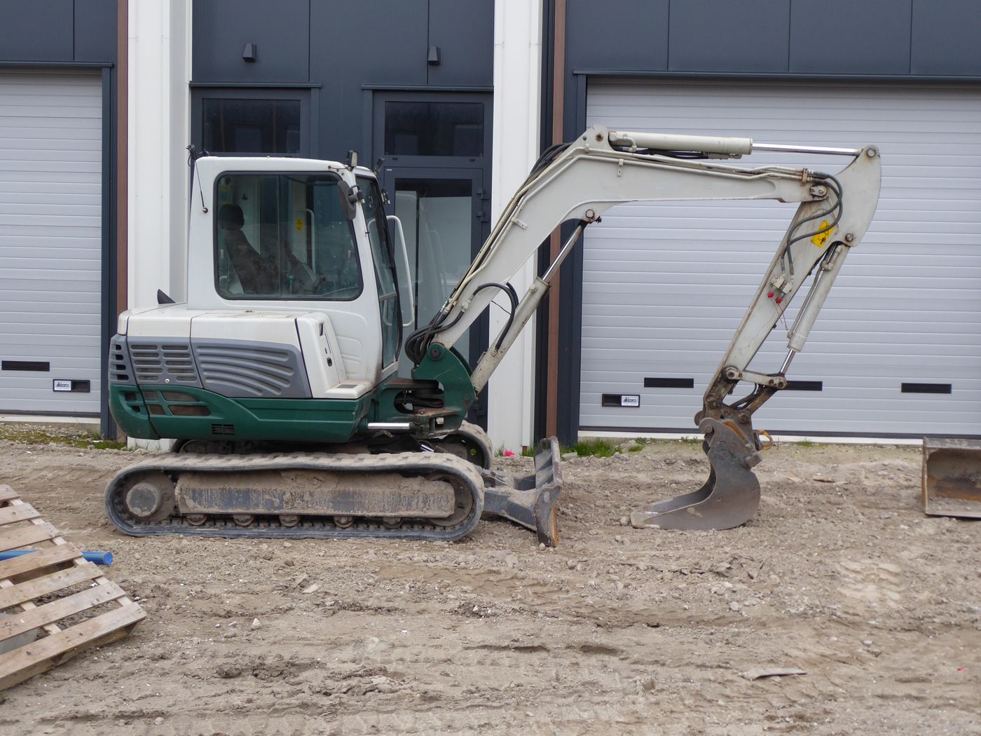 A compact excavator at work